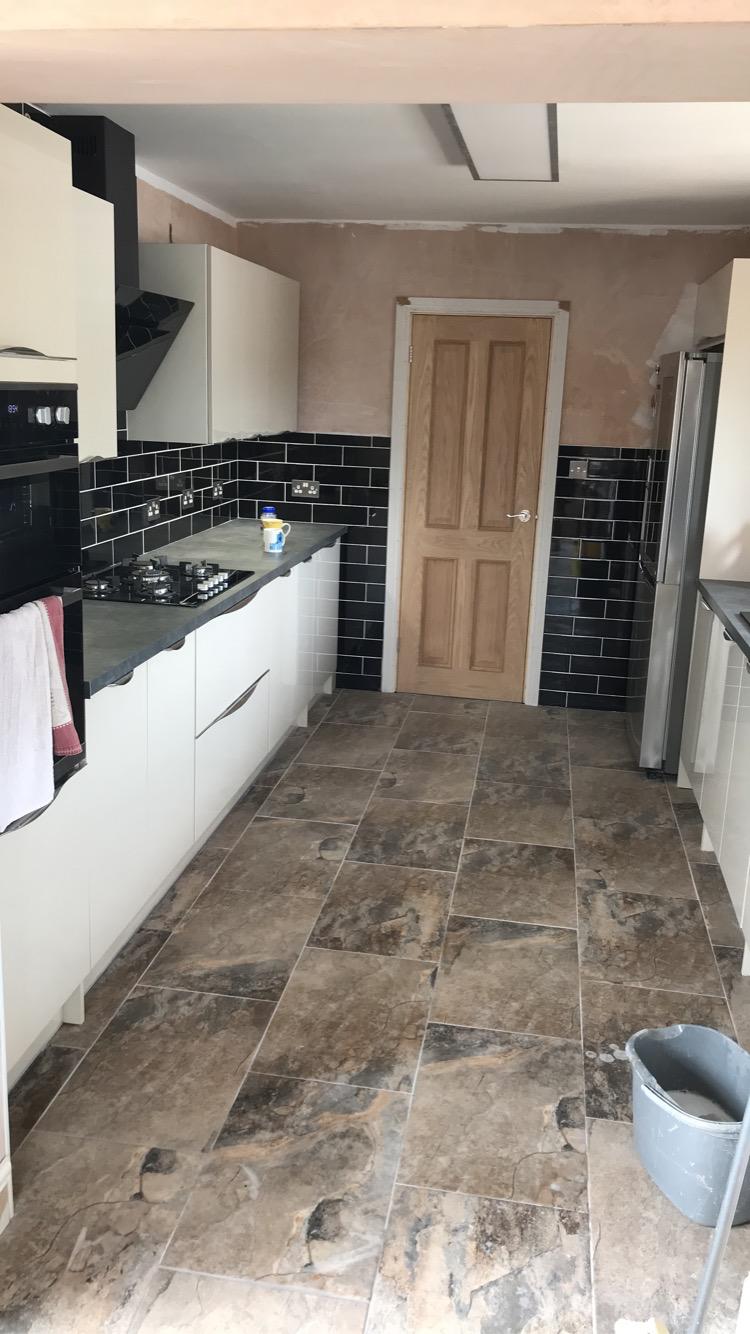Kitchen mid-fit with tiling underway